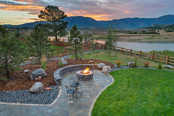 Custom outdoor kitchen installation with stone countertops in Glendale backyard